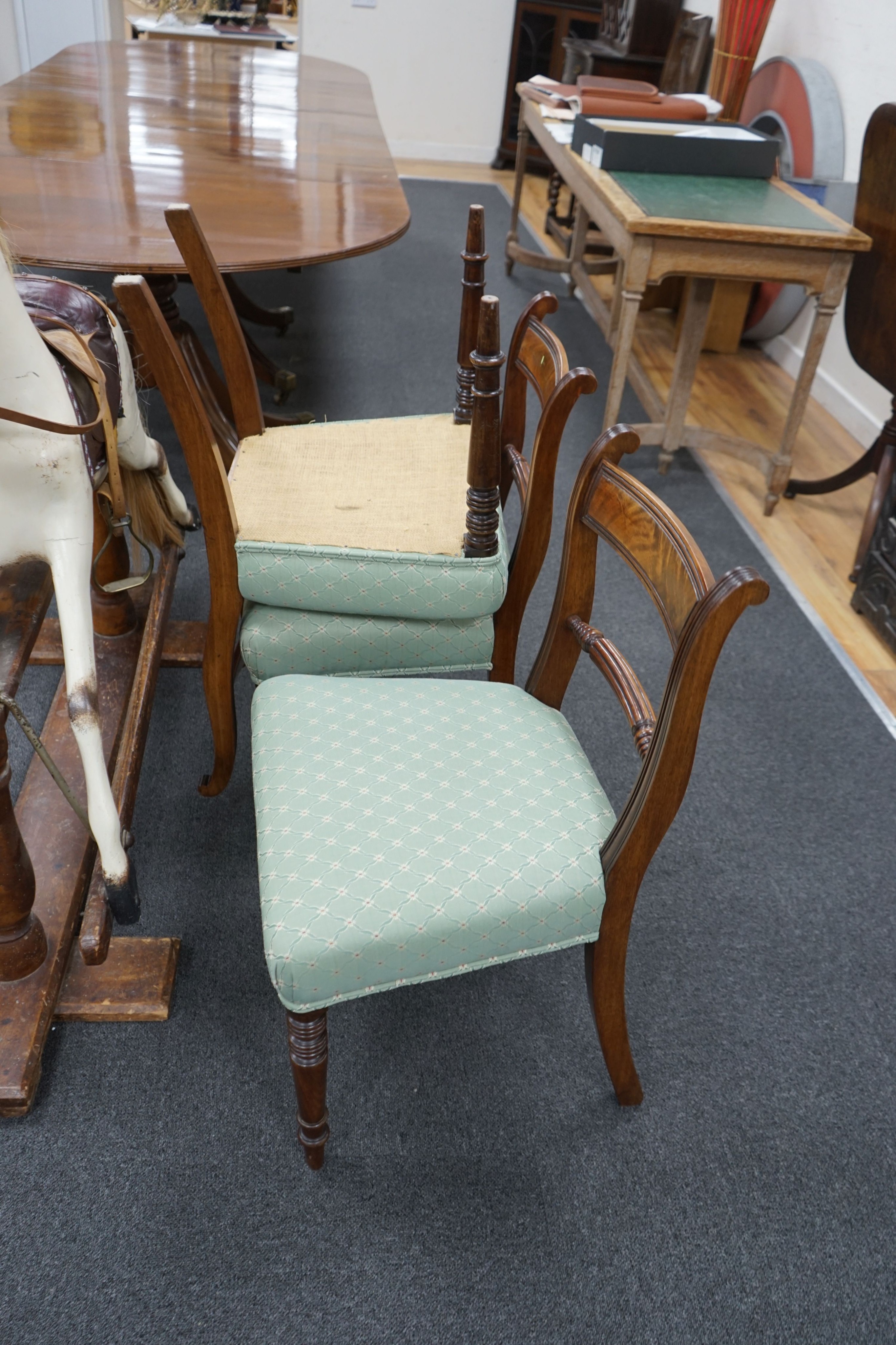 A set of eight Regency mahogany dining chairs with fluted spars, two with arms